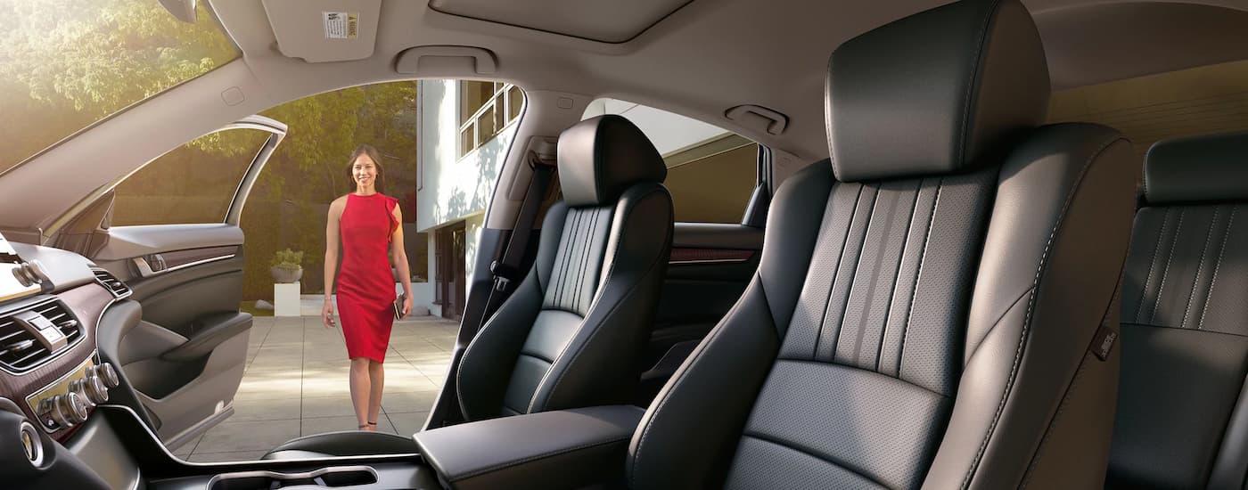 The interior of a 2022 Honda Accord shows the front seating a center console.