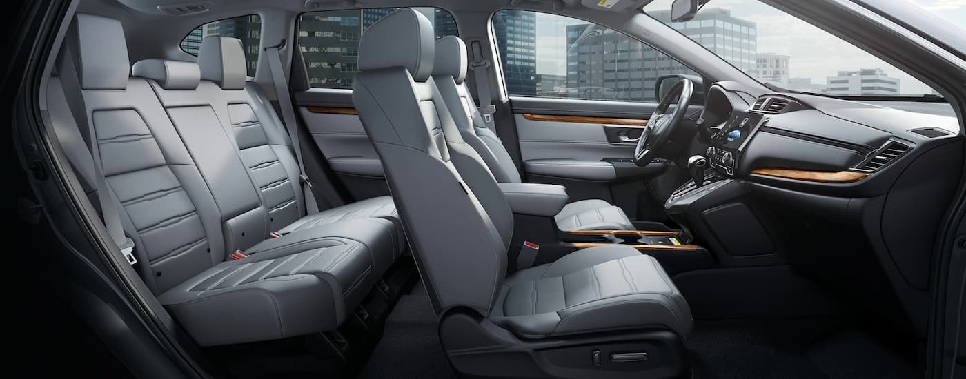 The grey interior of a 2022 Honda CR-V shows two rows of seating.
