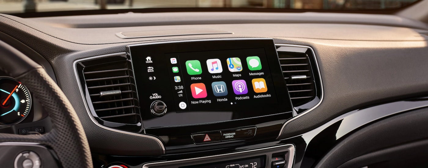 Apps are shown on the infotainment screen in a 2023 Honda Passport.