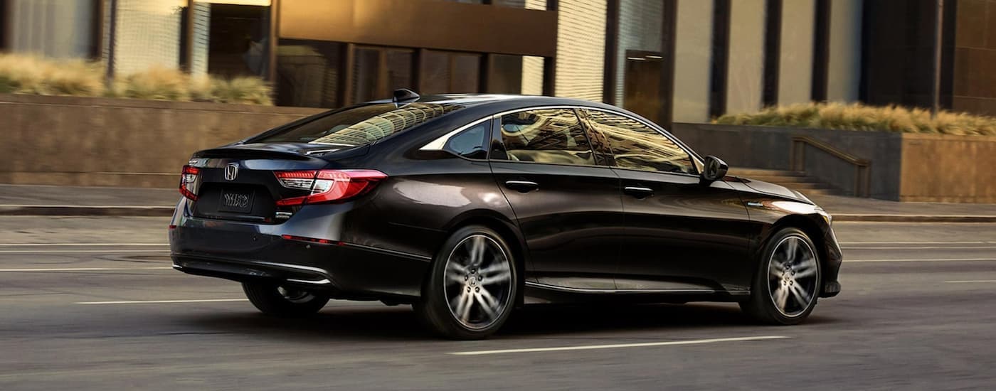 A black 2022 Honda Accord Hybrid for sale is shown from a rear angle.